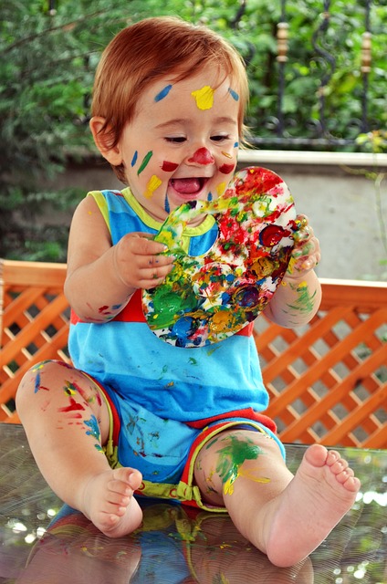Baby playing with safe paint